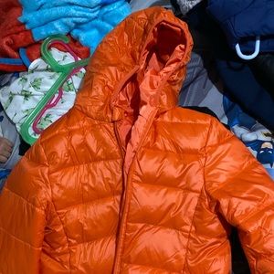 Orange puffed jacket boy